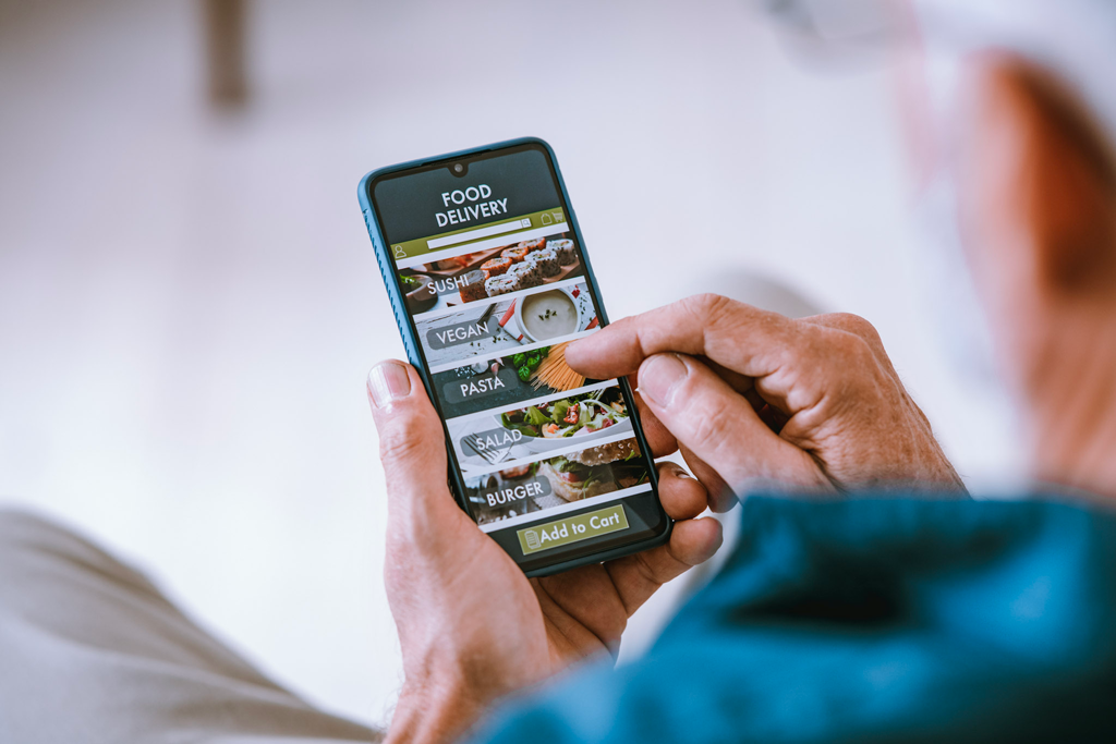 man using mobile application for fast food restaurant