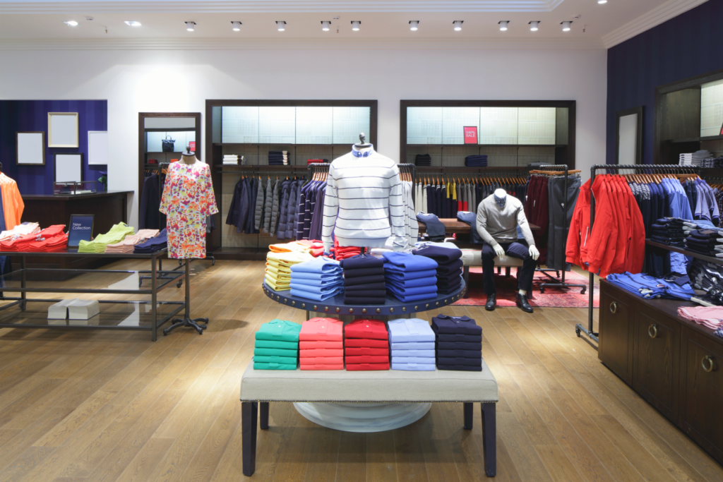 Lowering Retail Inventory | Worldlink Integration Group | Bright and vibrant image of clothing department store with limited retail inventory and open experimental environment