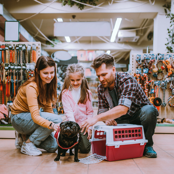 family at pet store with dog